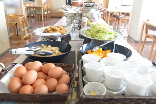 a buffet with eggs and vegetables on a table at APA Hotel Suzuka-Chuou in Suzuka