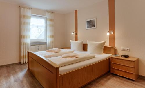 Ένα ή περισσότερα κρεβάτια σε δωμάτιο στο Ferienhaus Zenz - Ferienwohungen