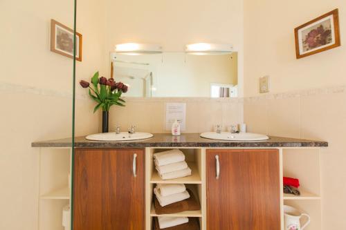 a bathroom with two sinks and a mirror at Dublin Vacation Rentals in Dublin