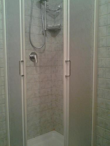 a shower with a glass door in a bathroom at Hotel Brufa in Monteleone di Spoleto