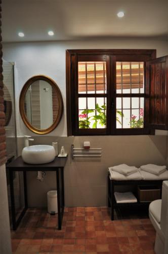 a bathroom with a sink and a mirror at Casa Silca in Marbella