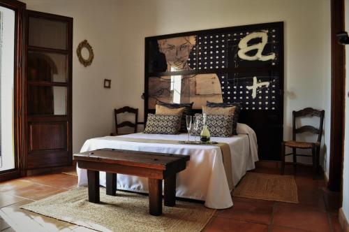 a bedroom with a bed with a table in it at Casa Silca in Marbella