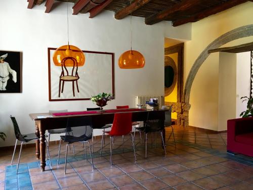 a dining room with a table and chairs at B&B Bellini in Naples