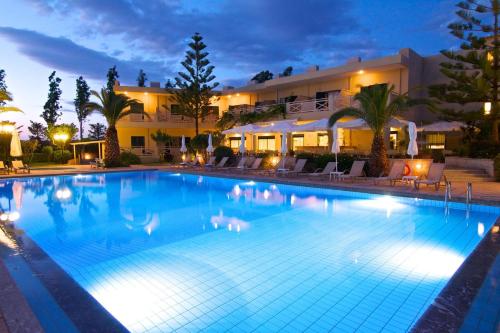 a large swimming pool in front of a building at Solimar Ruby in Malia