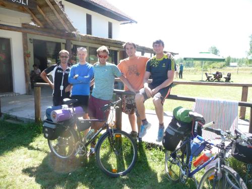 a group of people posing for a picture with their bikes at Motel Zaborje in Pluzine
