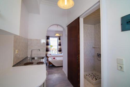 a bathroom with a sink and a bath tub at Villa Doris in Laganas