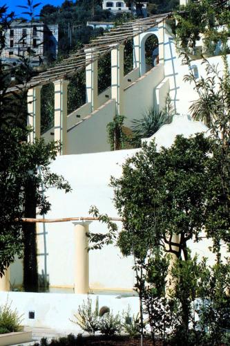 a building with stairs and trees in front of it at SalernoPrestige rooms in Salerno