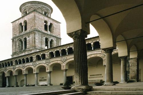a large building with a clock tower in the background at SalernoPrestige rooms in Salerno