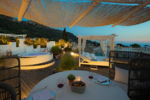a patio with a table and a gazebo at Hotel Villa Blu Capri in Anacapri