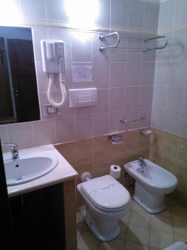 a bathroom with a toilet and a sink at Hotel Ristorante Antica Marina in Nicotera Marina