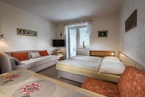 A bed or beds in a room at ALMET štúdio 404