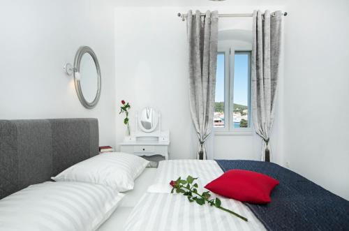 Giường trong phòng chung tại Apartments Mihaela