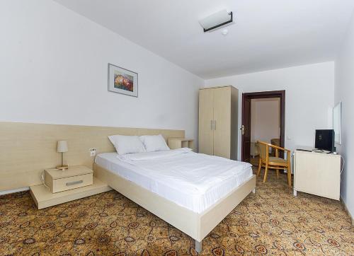 Ένα ή περισσότερα κρεβάτια σε δωμάτιο στο AselTur Brasov