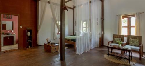 Postel nebo postele na pokoji v ubytování Isann Lodge