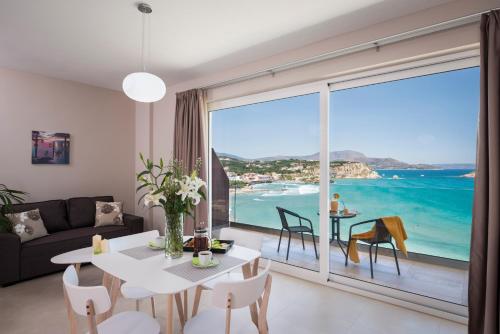 a living room with a view of the ocean at Panorama+ in Almirida