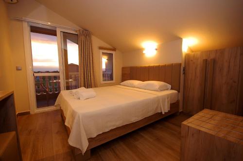 Postel nebo postele na pokoji v ubytování John & Eve Hotel