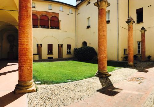 a group of columns in front of a building at TL Palazzo Fantuzzi in Bologna