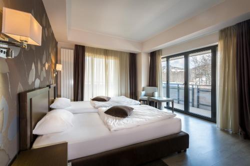 เตียงในห้องที่ Hotel Stara Planina