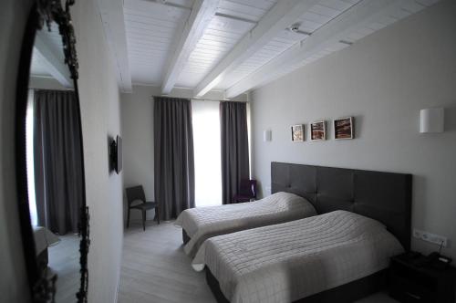 Кровать или кровати в номере Hotel Nika 2
