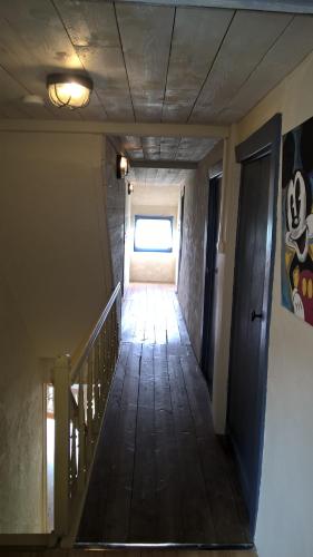 a hallway of a building with a stairway at Vakantiehuis Le Colombage in Beauraing