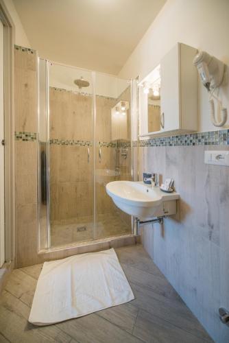 a bathroom with a sink and a shower at Hotel Ristorante Crescenzo in Procida