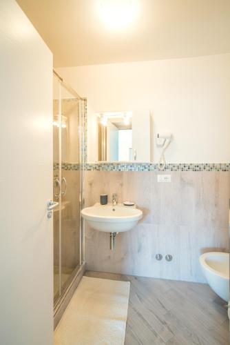 a bathroom with a sink and a shower at Hotel Ristorante Crescenzo in Procida