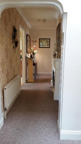 an empty hallway with a fireplace in a house at Abacus Guesthouse in Galway