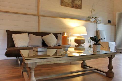 a living room with a couch and a coffee table at Torre del Falco in Spoleto