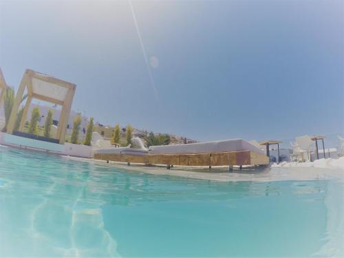 a view of a swimming pool at a resort at Callia Retreat Suites - Adults Only in Fira