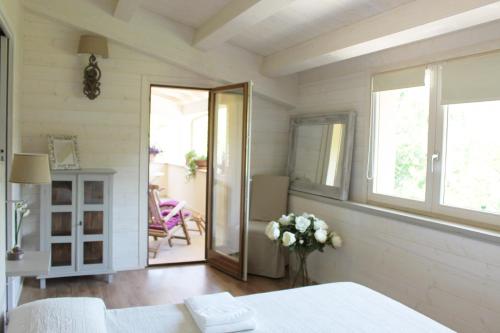 a room with a table and a vase of flowers at Torre del Falco in Spoleto