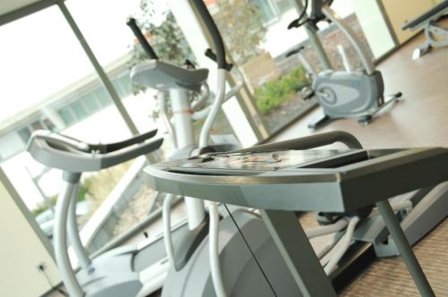 a row of exercise bikes in a gym at Hotel du Pasino in Saint-Amand-les-Eaux