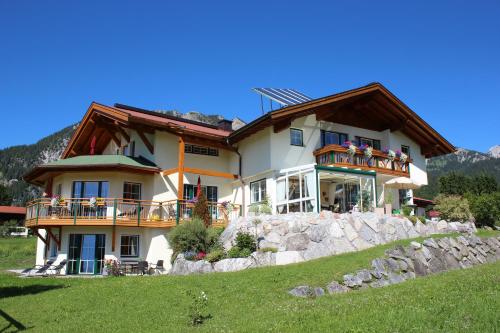 a large house on top of a hill at Am Schwand in Grän