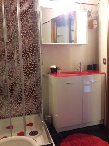 a bathroom with a shower and a sink at Poppy's House in Casole dʼElsa