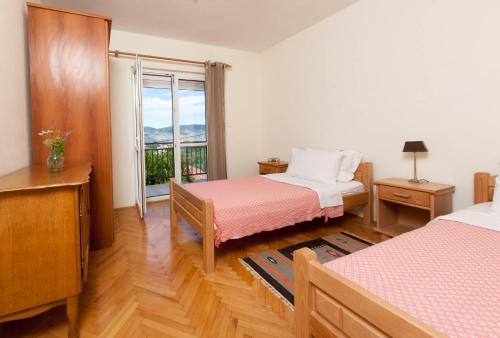 Postel nebo postele na pokoji v ubytování Olive Tree Villa