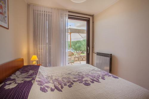 Postel nebo postele na pokoji v ubytování Apartments Ljubo & Lili