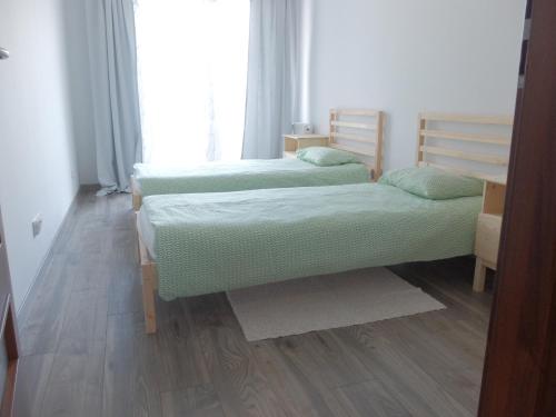 Posteľ alebo postele v izbe v ubytovaní Pixel White Apart