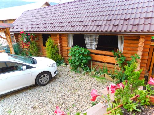 a white car parked in front of a house at Glanz in Yaremche
