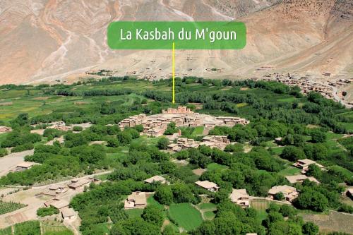 an aerial view of a village with a sign that reads la kishi do mi at La Kasbah du M'goun in Timit