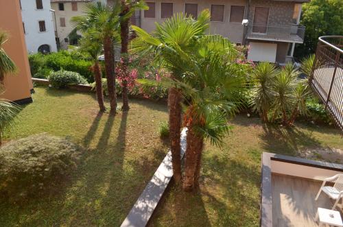an aerial view of a yard with palm trees at SunLake Hotel in Riva del Garda