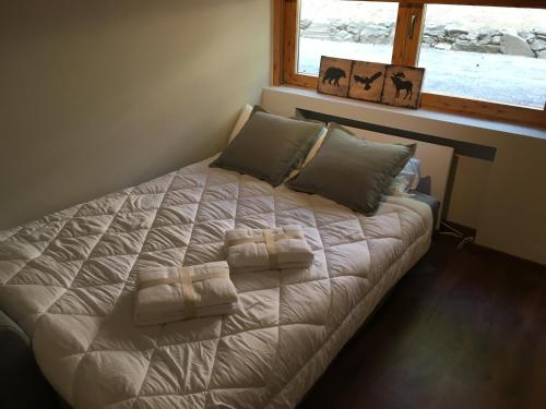 Łóżko lub łóżka w pokoju w obiekcie La Pinilla Ski Apartment