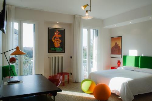 Boutique Hotel Trieste - Adults Only tesisinde bir odada yatak veya yataklar