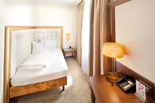 Katil atau katil-katil dalam bilik di Hotel Goldener Adler, BW Signature Collection