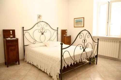 Agriturismo San Lino-Gilberto tesisinde bir odada yatak veya yataklar