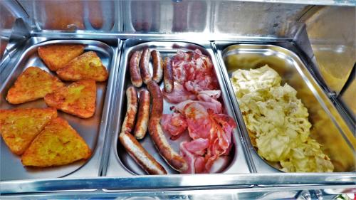 a plastic container filled with different types of food at Hotel Am Kurpark in Malente