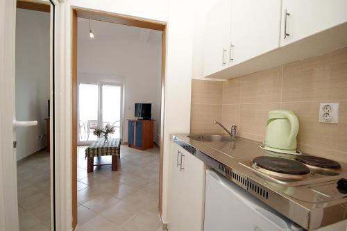 a kitchen with a sink and a counter top at Apartments Vila Dusan in Sutomore