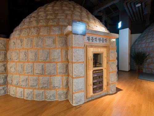 an exhibit of a brick building with a door in it at Hotel Park Habio in Seoul
