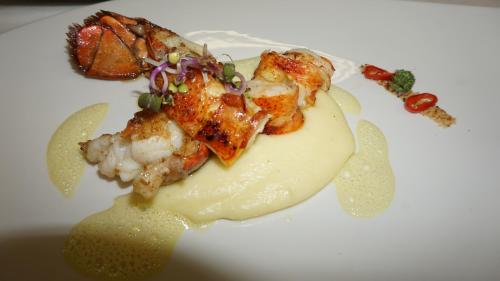 a plate of food on a white plate at Caschu Alp Boutique Design Hotel Stoos - adults only in Stoos