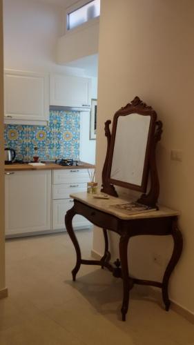 a mirror sitting on a table in a kitchen at Sciala' in Taormina