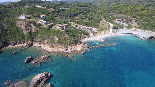an aerial view of a beach with blue water at Thalia Traditional Guest House in Promírion