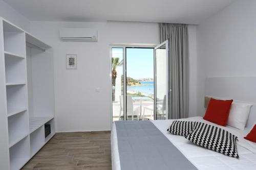 Postel nebo postele na pokoji v ubytování Blu Acqua Hotel